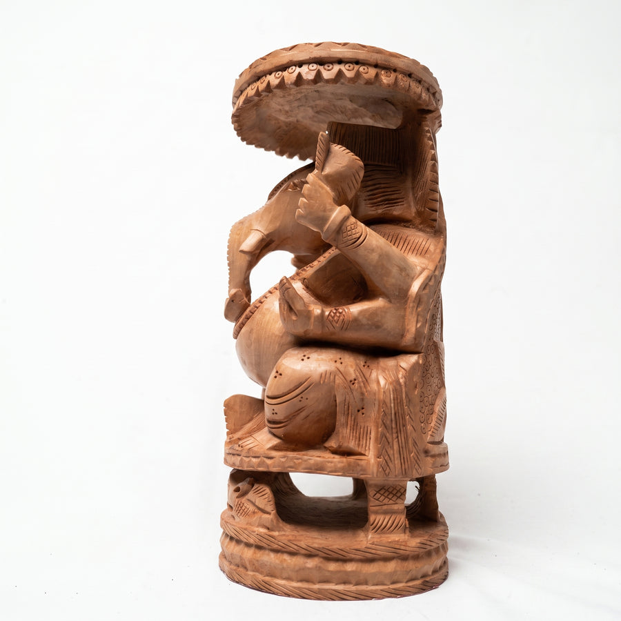 Lord Ganesha Beneath the Sacred Canopy – Wooden Carved Sculpture