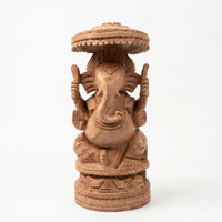 Lord Ganesha Beneath the Sacred Canopy – Wooden Carved Sculpture